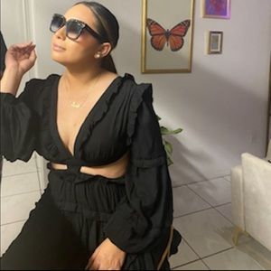 Black dress that shows midriff and open back. It’s only been worn once as shown